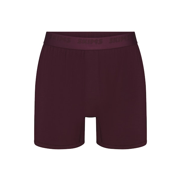 SKIMS STRETCH MENS KNIT BOXER | CURRANT FLAT ON A WHITE BACKGROUND | FLT