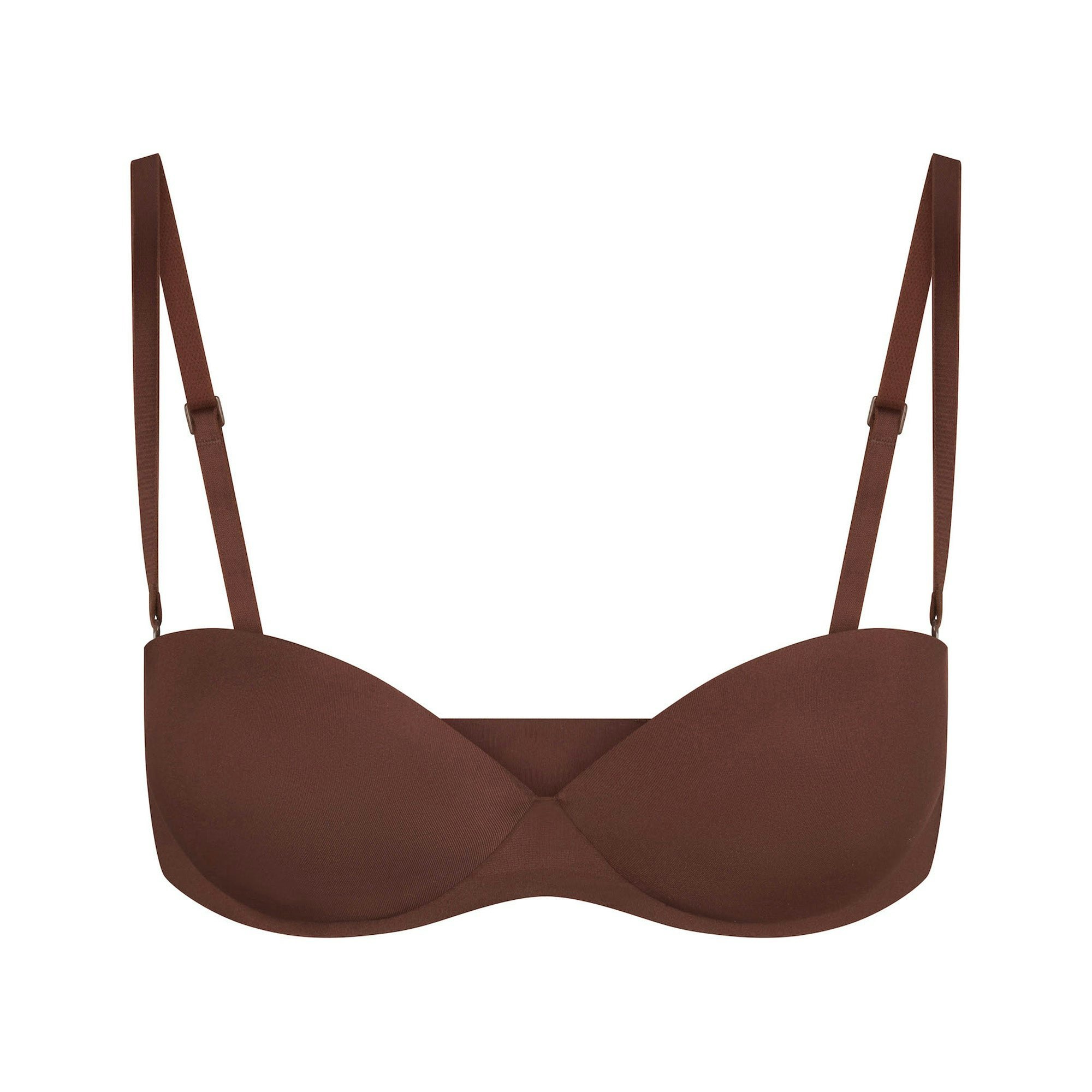 SKIMS ULTIMATE BRA STRAPLESS PUSH-UP BRA LAYS FLAT ON A WHITE BACKGROUND | FLT