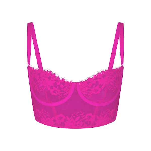 SKIMS LACE UNLINED BALCONETTE CORSET LAYS FLAT ON A WHITE BACKGROUND | FLT