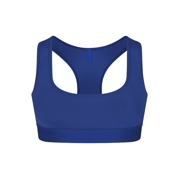SKIMS TRACK RACERBACK BRALETTE | COBALT (SCOOP BRALETTES) LAYS FLAT ON A WHITE BACKGROUND