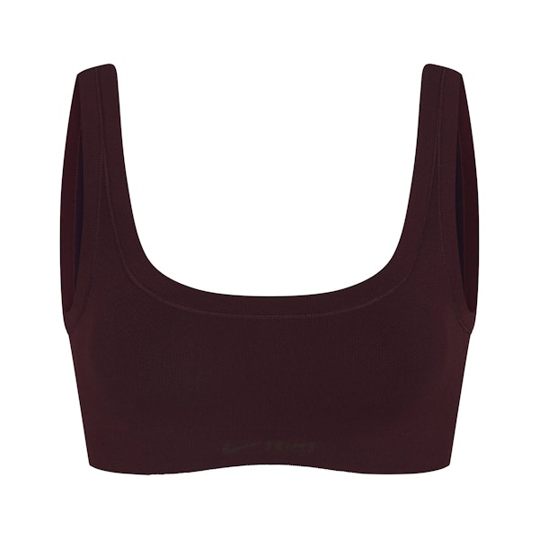 NikeSKIMS VINTAGE SEAMLESS SCOOP NECK BRA | CURRANT FLAT ON A WHITE BACKGROUND | FLT