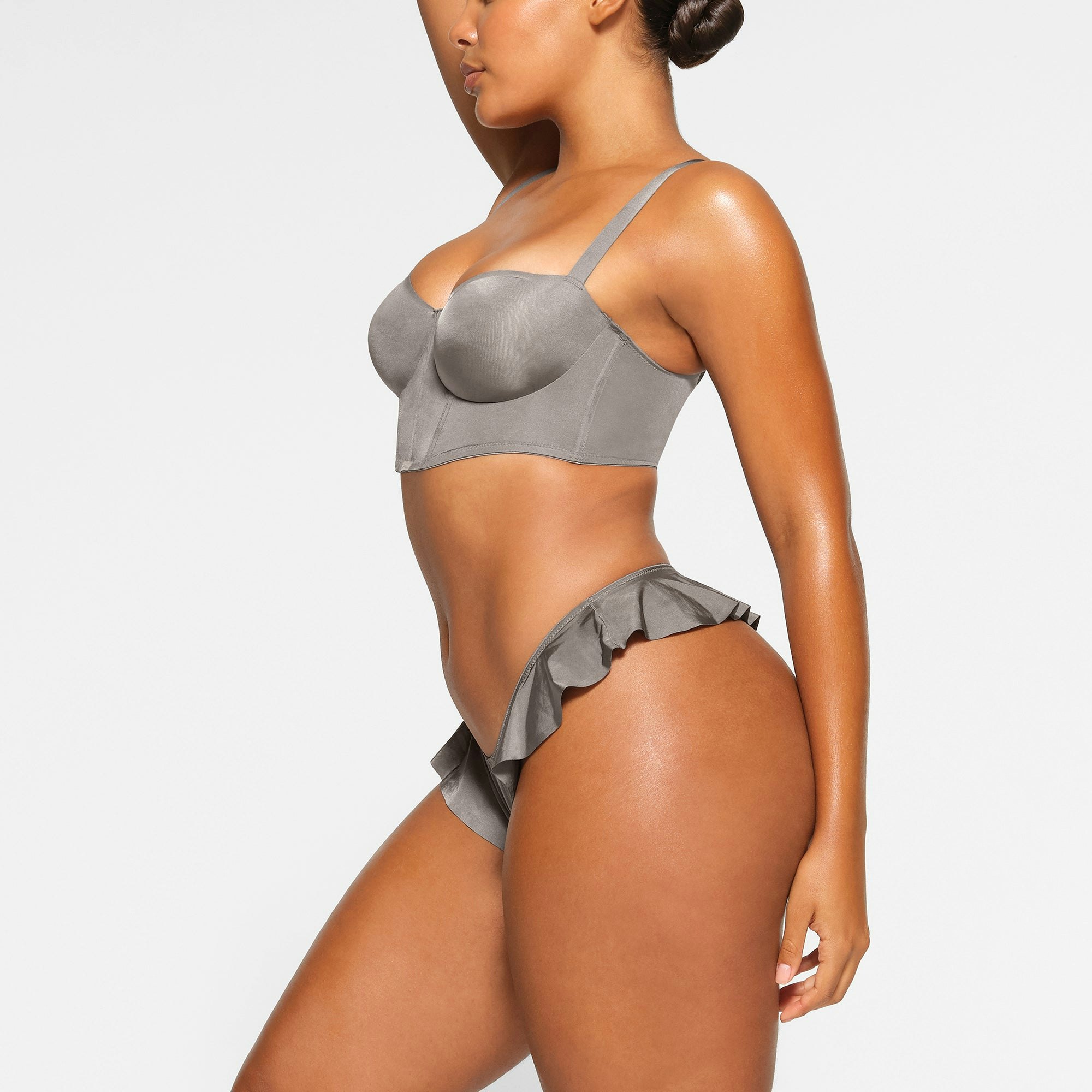 BALCONETTE CORSET BRA WORN BY A MODEL IN SIDE VIEW