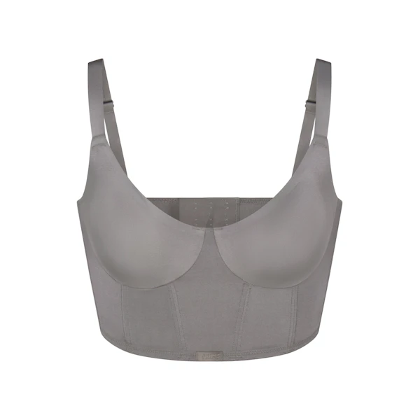 SKIMS LOGO SHINE DEMI CORSET BRA | GREY CHALK (CAMIS, BRAS) LAYS FLAT ON A WHITE BACKGROUND | FLT