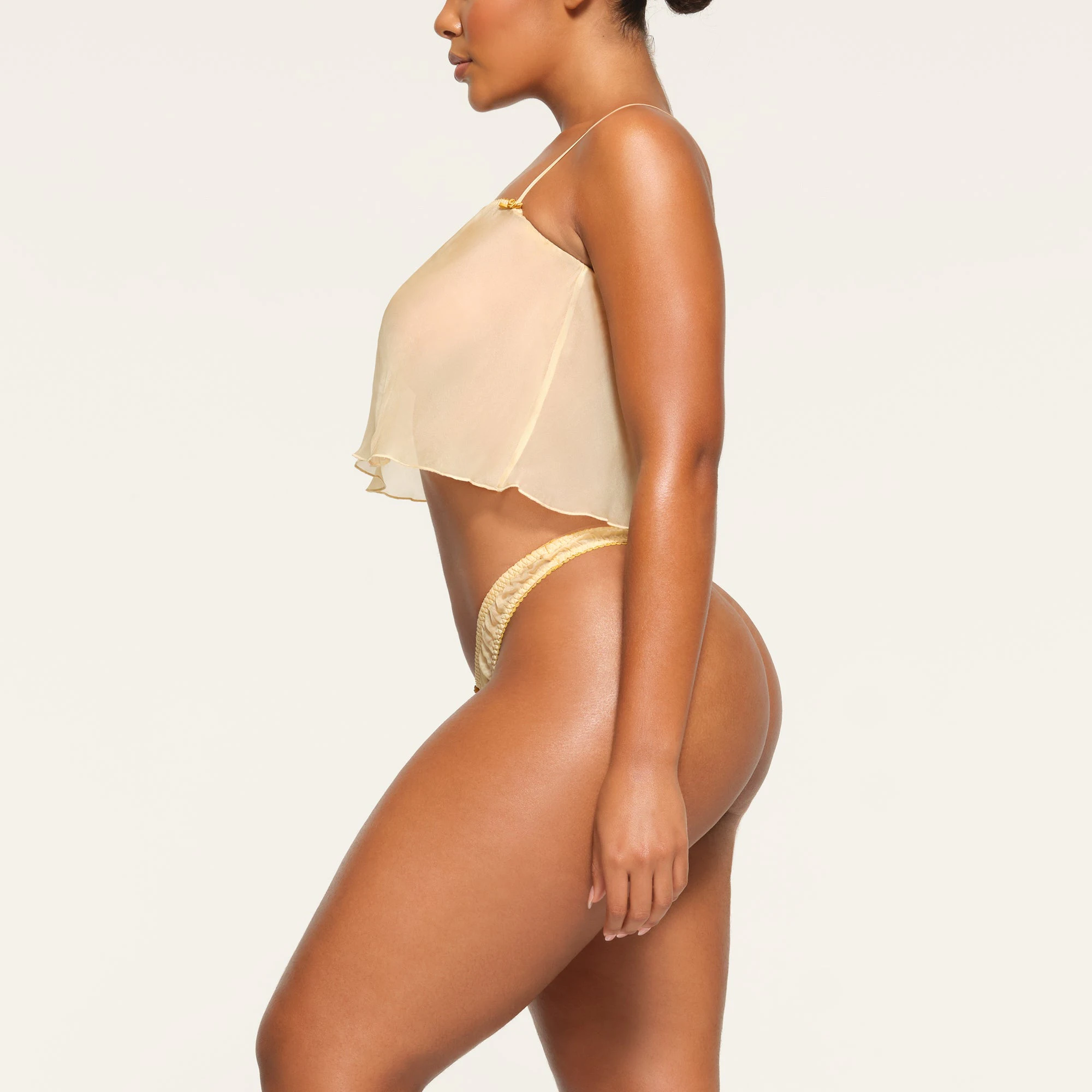 SKIMS ROMANCE SUPER CROPPED TOP WORN BY A MODEL IN SIDE VIEW