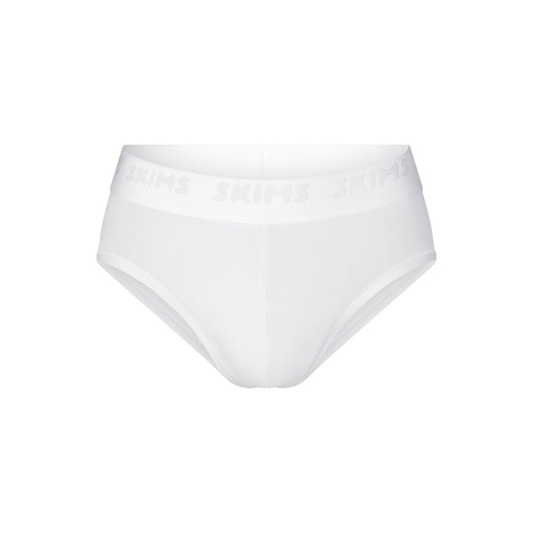 SKIMS STRETCH MENS BRIEF | CHALK (MENS BRIEFS, MENS UNDERWEAR) LAYS FLAT ON A WHITE BACKGROUND | FLT