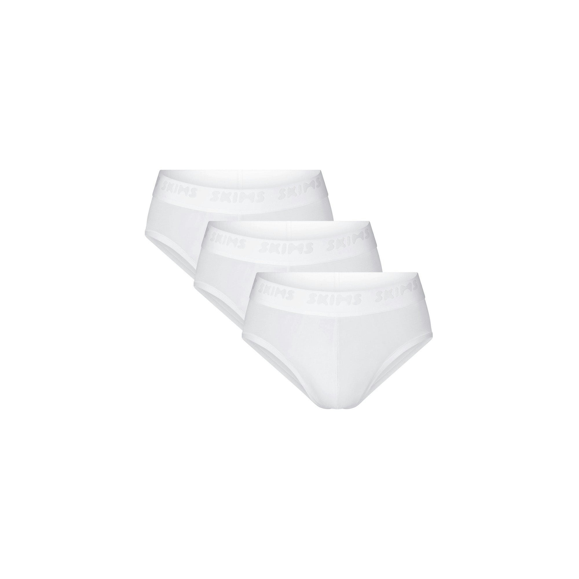 SKIMS STRETCH MENS BRIEF 3-PACK | CHALK (MENS BRIEFS, MENS UNDERWEAR) LAYS FLAT ON A WHITE BACKGROUND | FLT | FOCUS: 0.0, 1.0, 0.9