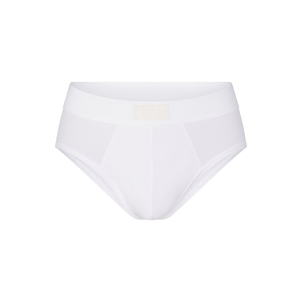 SKIMS COTTON MENS BRIEF | CHALK (MENS BRIEFS, MENS UNDERWEAR) LAYS FLAT ON A WHITE BACKGROUND | FLT