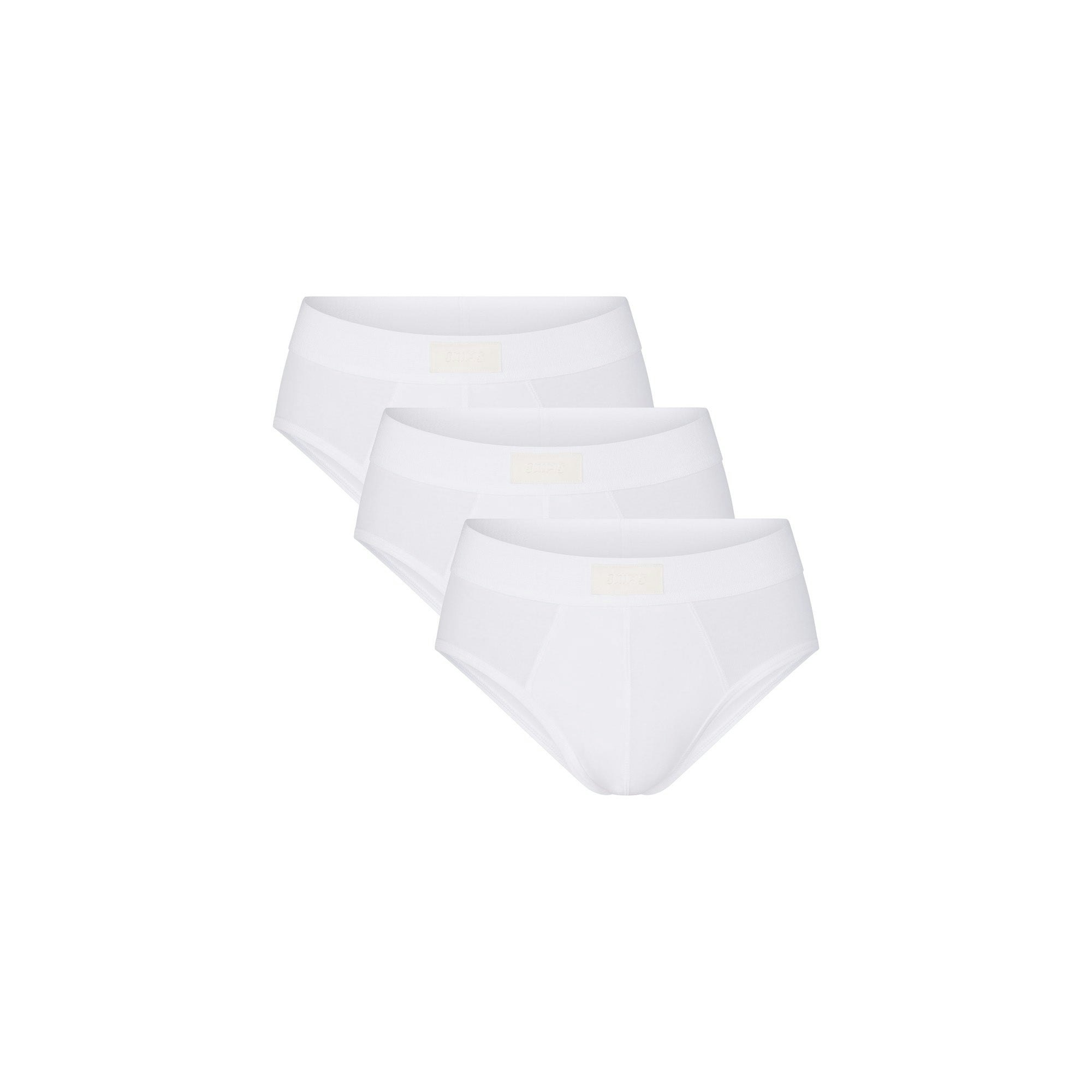 SKIMS COTTON MENS BRIEF 3-PACK | CHALK (MENS BRIEFS, MENS UNDERWEAR) LAYS FLAT ON A WHITE BACKGROUND | FLT  | FOCUS: 0.0, 1.0, 0.9