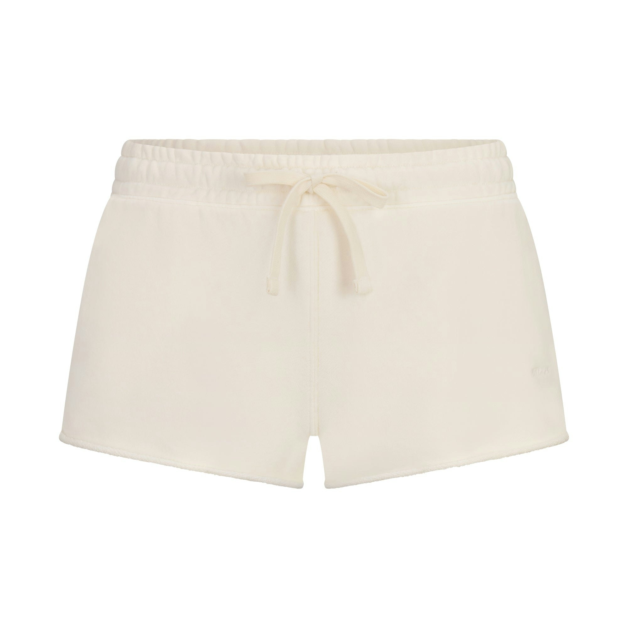 FRENCH TERRY RAW EDGE SHORT | ECRU LAYS FLAT ON A WHITE BACKGROUND | FLT