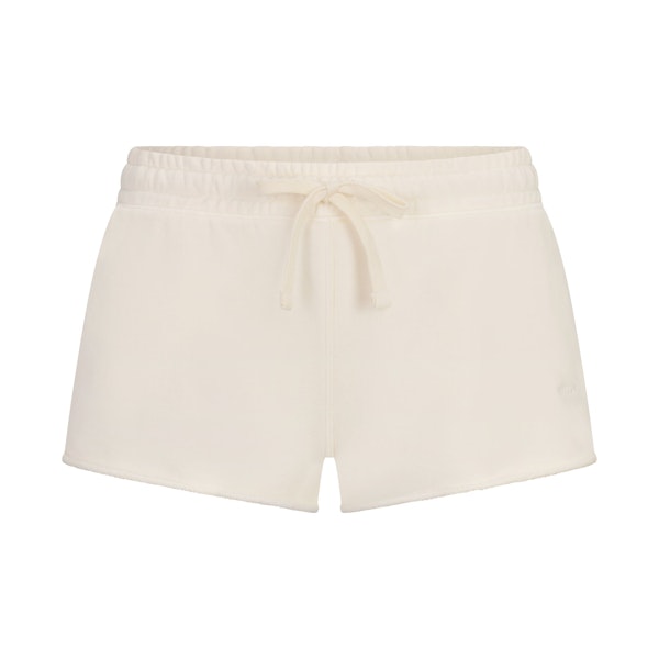 FRENCH TERRY RAW EDGE SHORT | ECRU LAYS FLAT ON A WHITE BACKGROUND | FLT