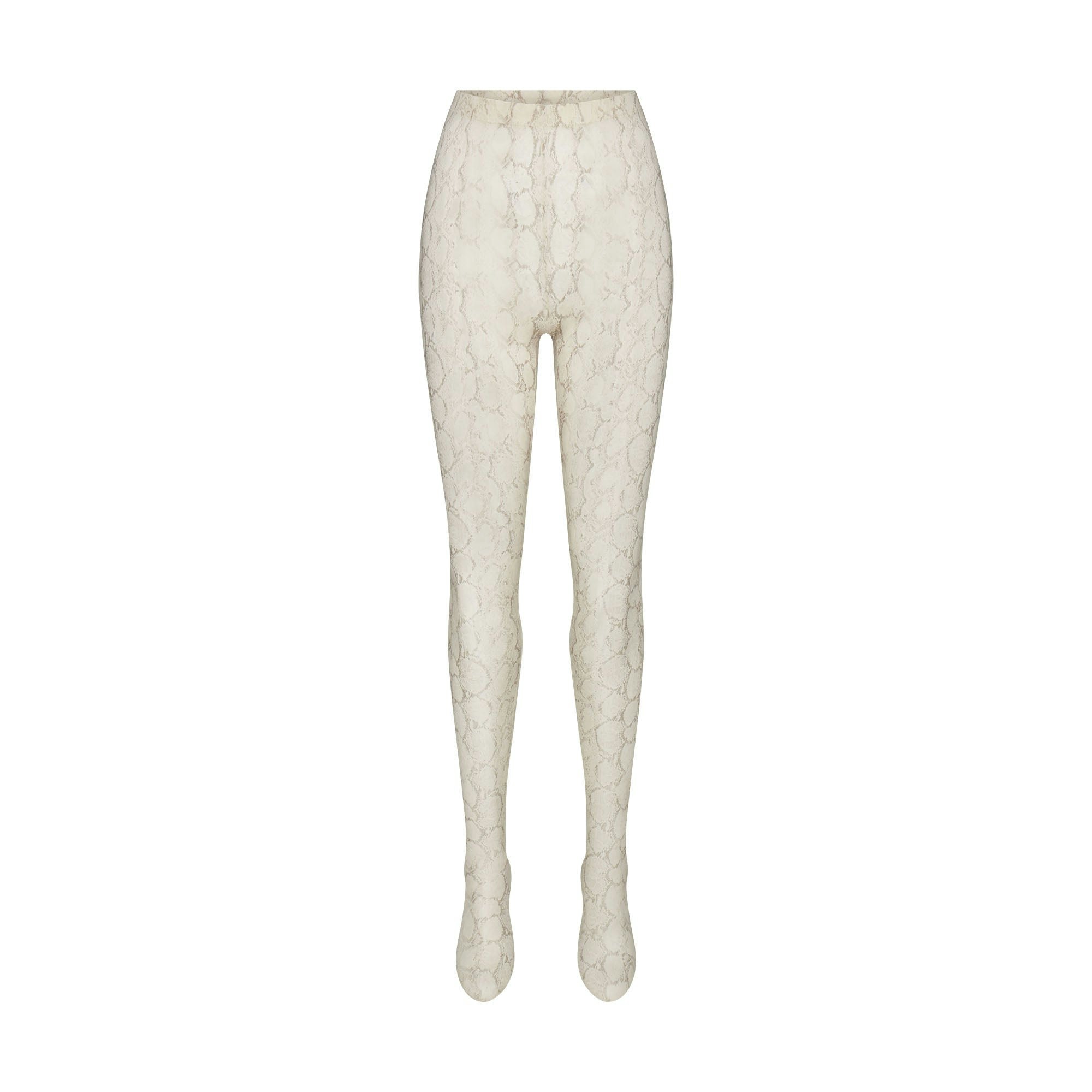 MILKY SHEER FOOTED LEGGING | STONE PASTEL SNAKE PRINT FLAT ON A WHITE BACKGROUND | FLT