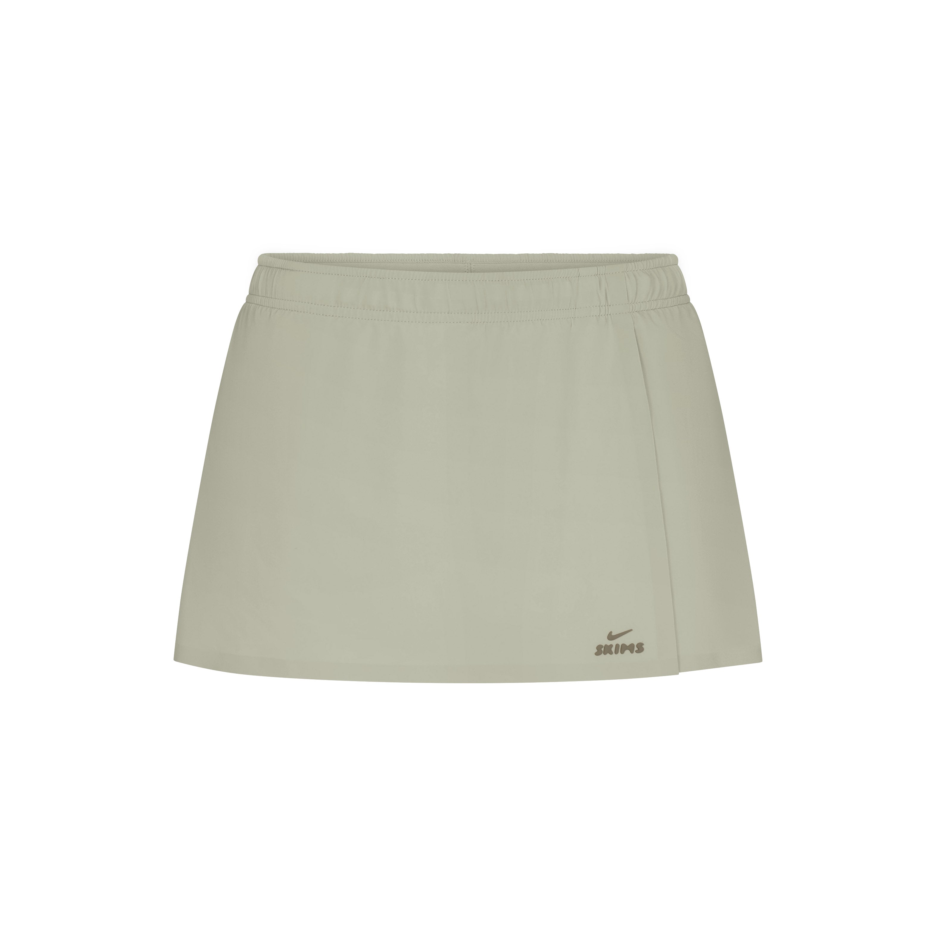 NikeSKIMS STRETCH NYLON SKORT | TALC & LAYS FLAT ON A WHITE BACKGROUND | FLT