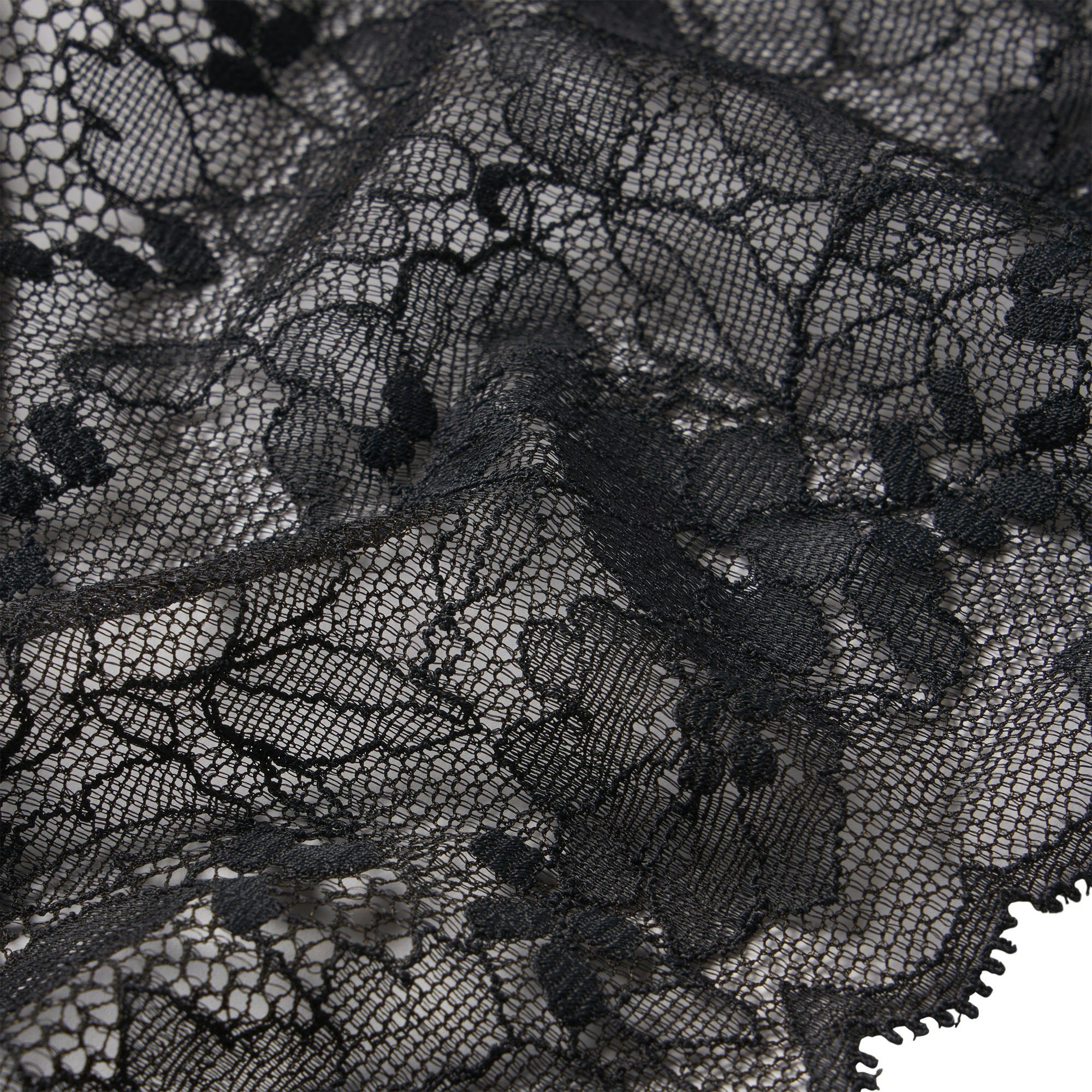 SKIMS LACE THONG | ONYX ON A MODEL FRONT VIEW @ | FOCUS: 0.0, 1.0, 0.9