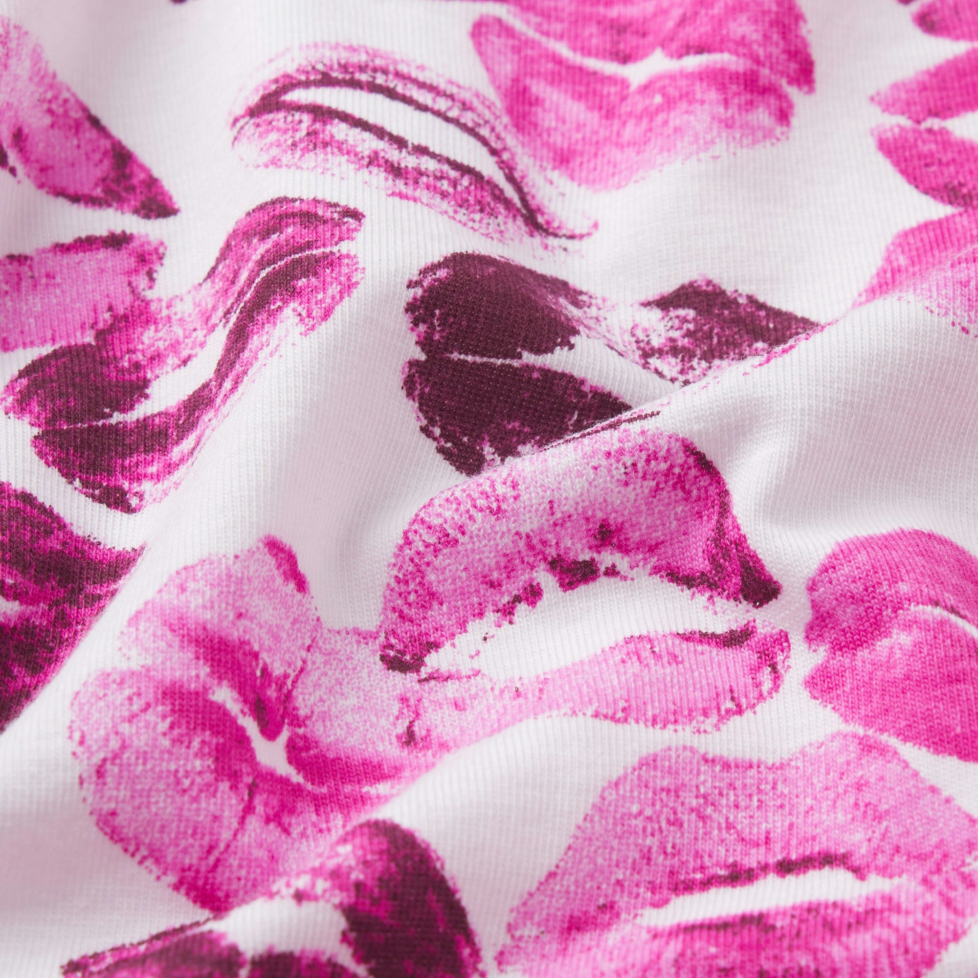 LIGHTWEIGHT COTTON LACE THONG | PINK ALLOVER LIPSTICK FLAT ON A WHITE BACKGROUND