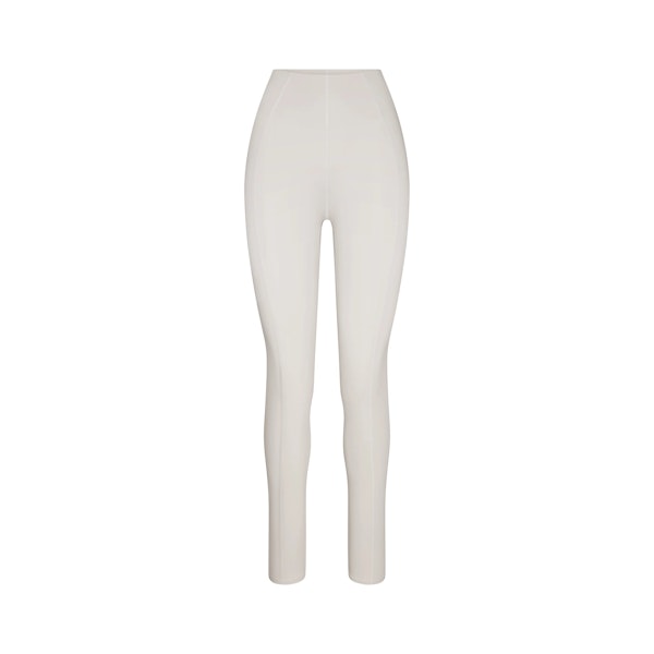 THE NORTH FACE X SKIMS REFINA LEGGING | BONE FLAT ON A WHITE BACKGROUND | FLT