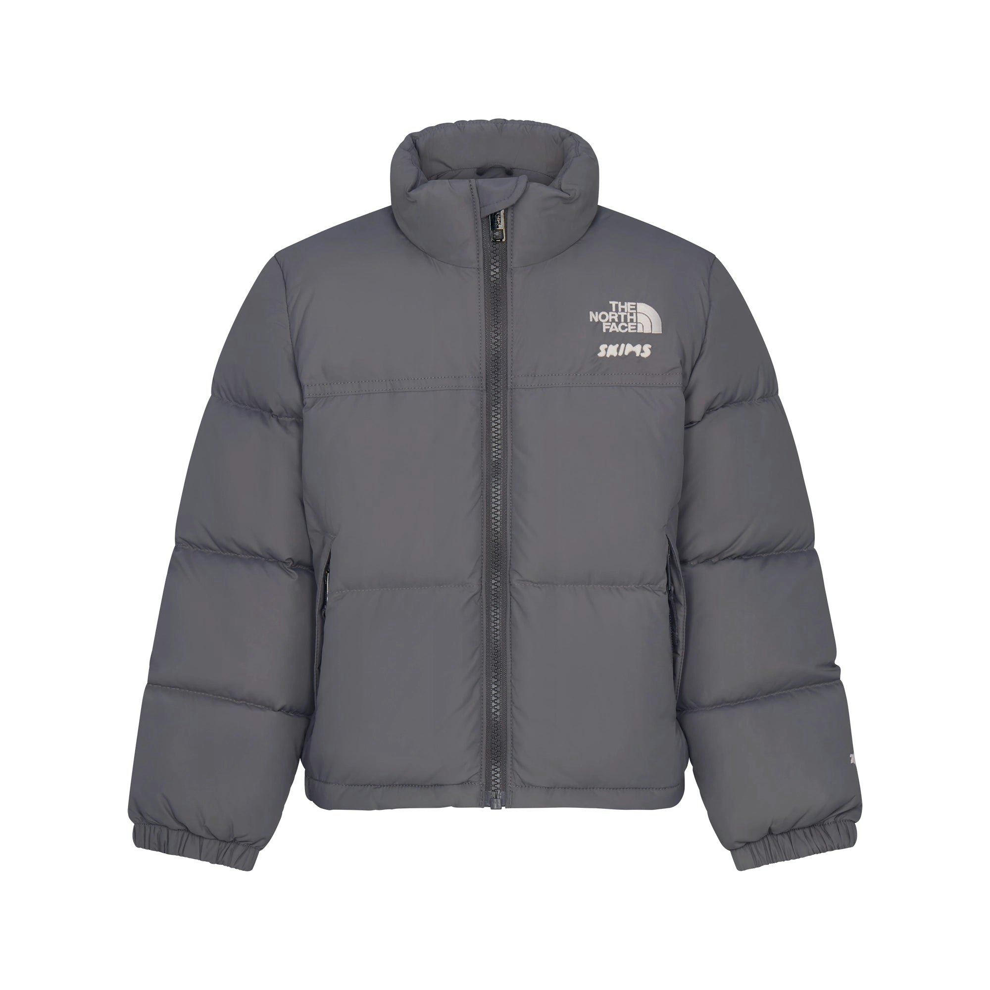 THE NORTH FACE X SKIMS KIDS' 1996 NUPTSE JACKET | GUNMETAL FLAT ON A WHITE BACKGROUND | FLT
