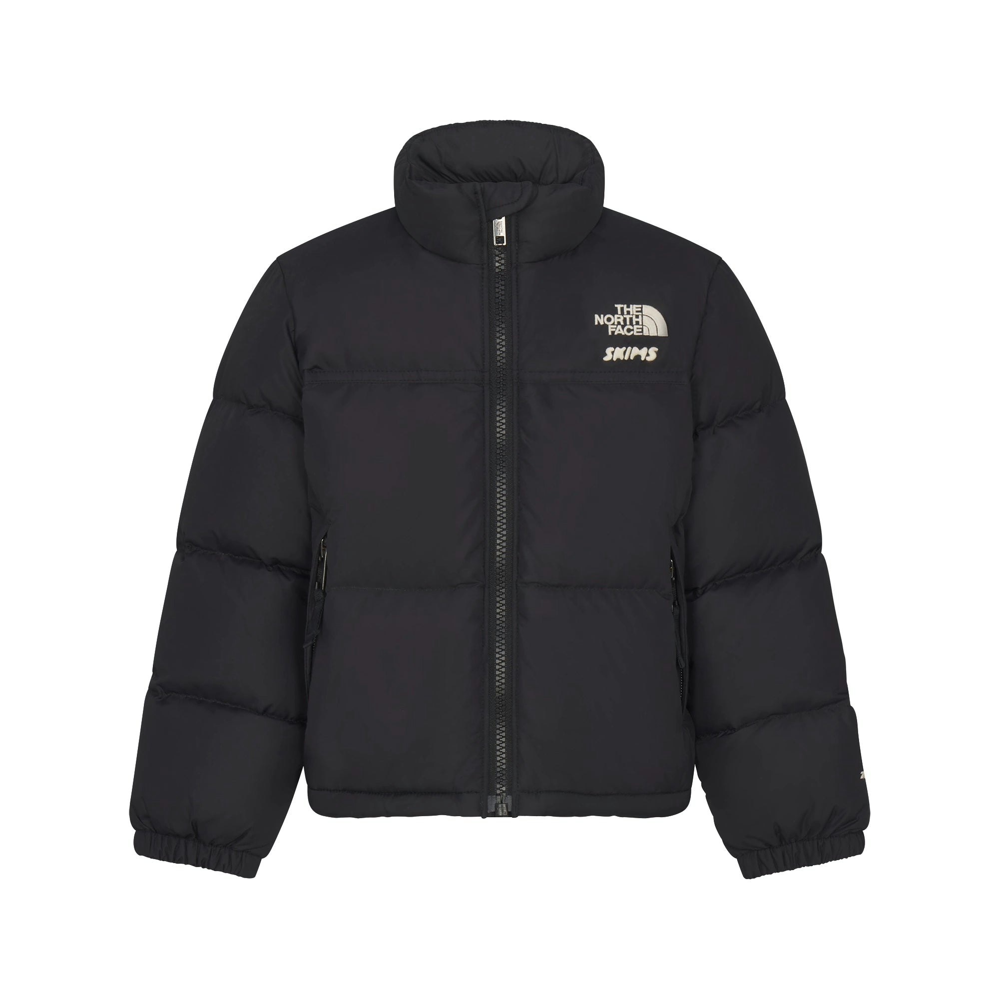 THE NORTH FACE X SKIMS KIDS' 1996 NUPTSE JACKET | ONYX FLAT ON A WHITE BACKGROUND | FLT