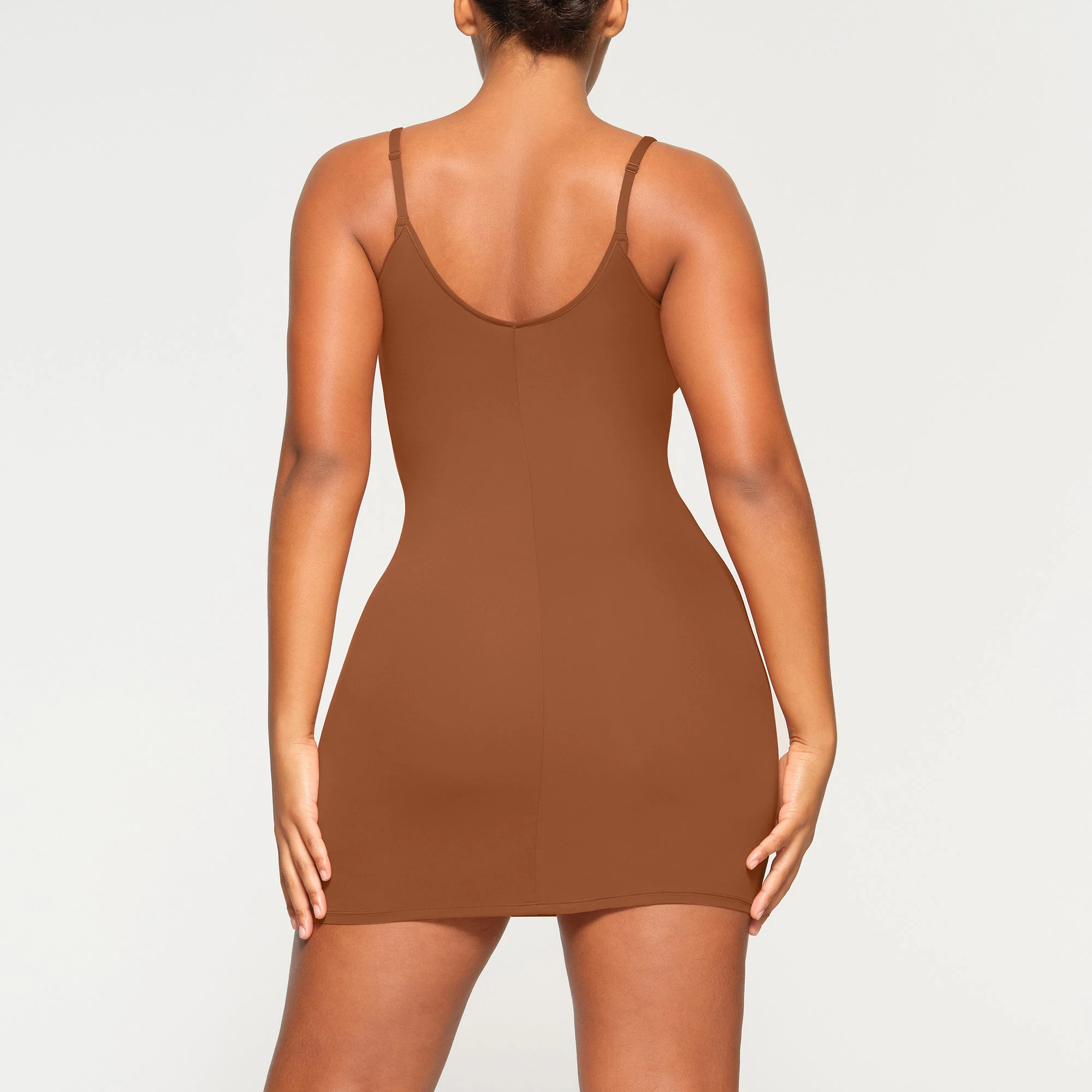 FITS EVERYBODY SLIP DRESS WORN BY A MODEL IN BACK VIEW