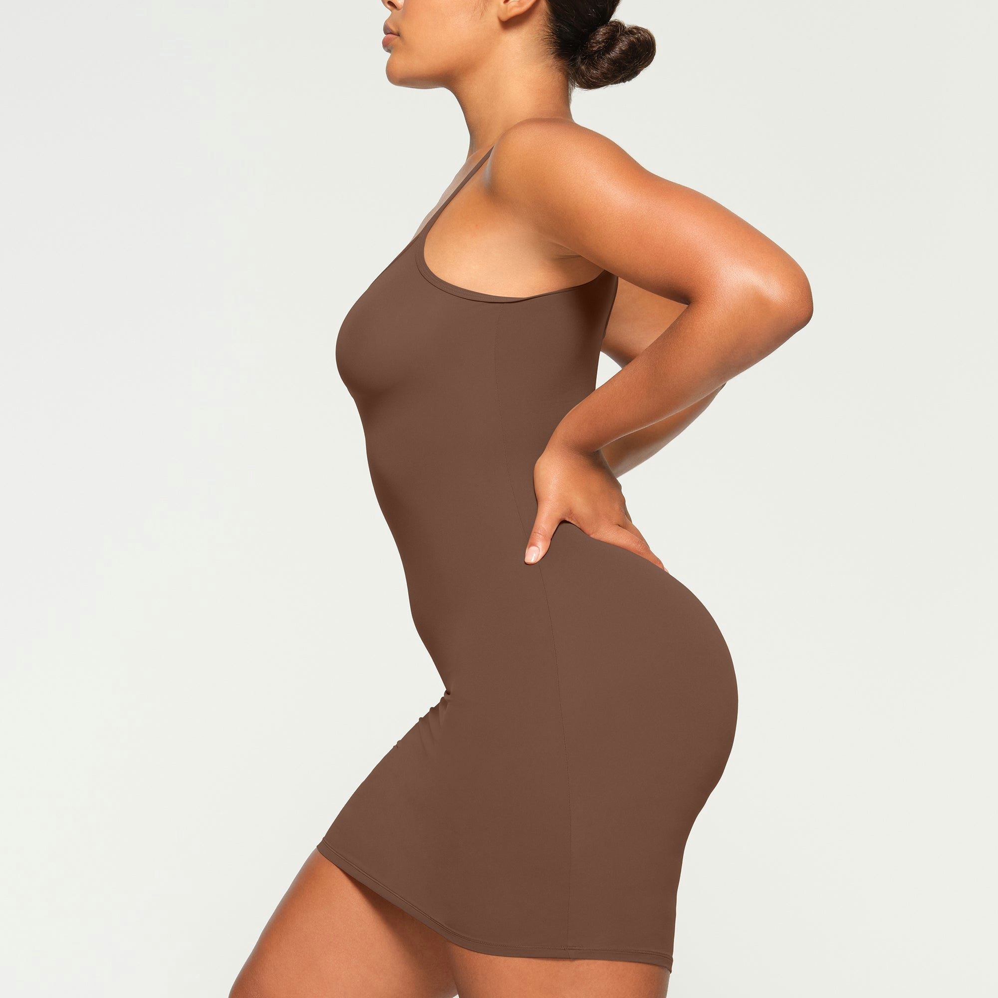 FITS EVERYBODY SLIP DRESS WORN BY A MODEL IN SIDE VIEW