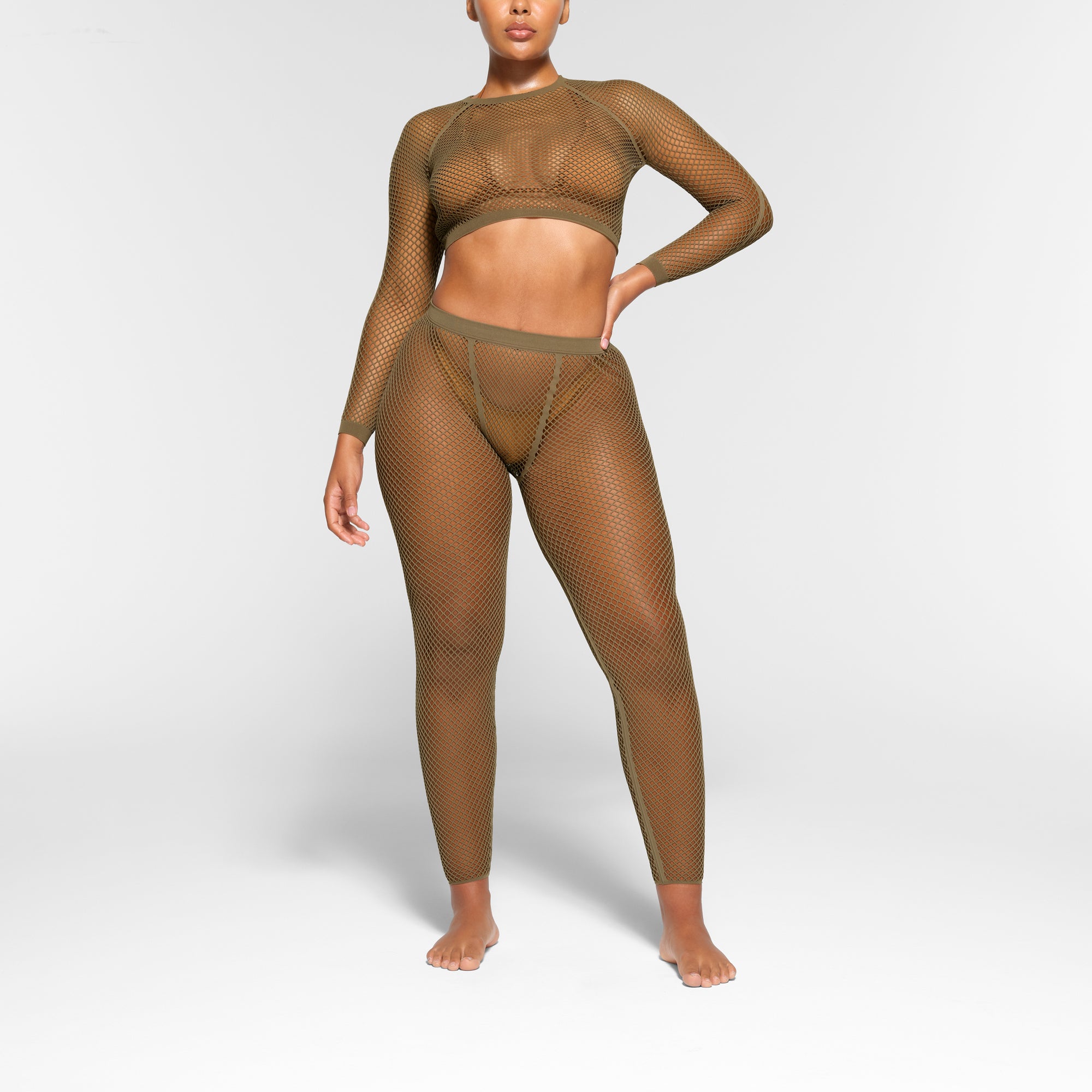 WARP KNIT COVER UP LONG SLEEVE CROPPED TOP WORN BY A MODEL IN FRONT VIEW