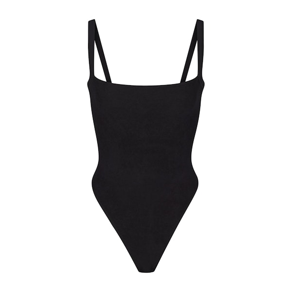 TERRY LOUNGE SEAMLESS BODYSUIT | ONYX (BODYSUITS) LAYS FLAT ON A WHITE BACKGROUND | FLT