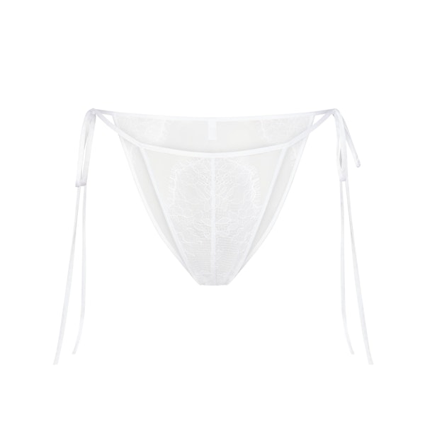 SKIMS LACE TIE SIDE BIKINI | SNOW (BIKINIS, PANTIES) LAYS FLAT ON A WHITE BACKGROUND | FLT