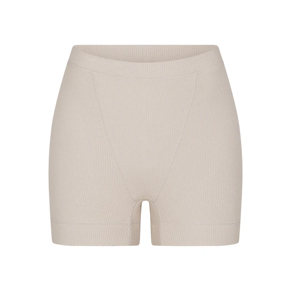 WAFFLE BOXER LAYS FLAT ON A WHITE BACKGROUND