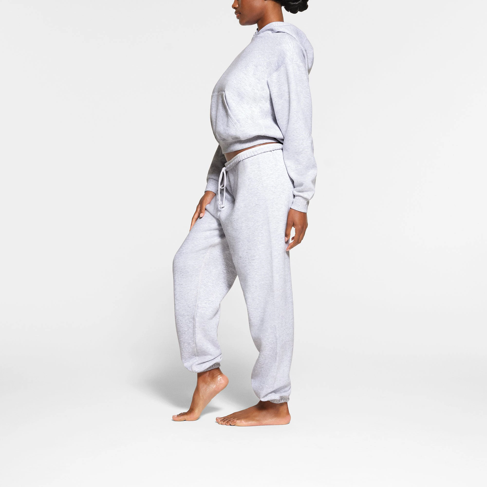 COTTON FLEECE JOGGER WORN BY A MODEL IN SIDE VIEW