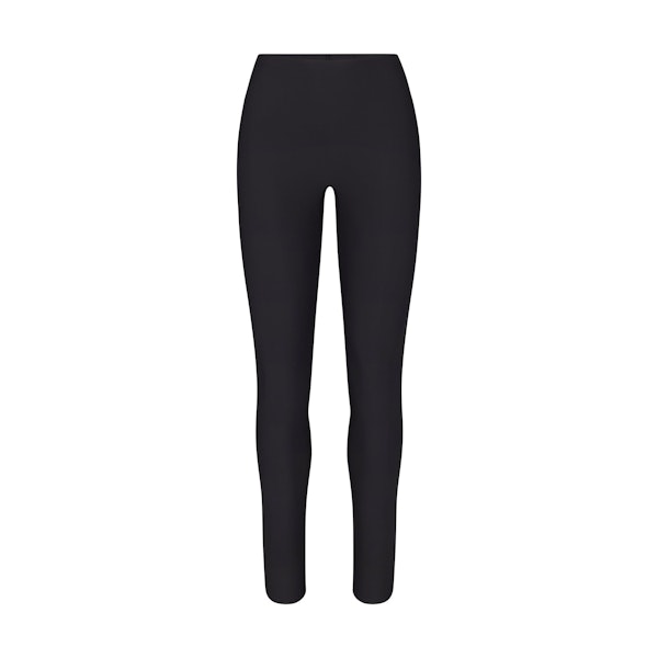SKIMS BODY LEGGING | ONYX (SHAPEWEAR LEGGINGS, SHAPEWEAR) LAYS FLAT ON A WHITE BACKGROUND | FLT