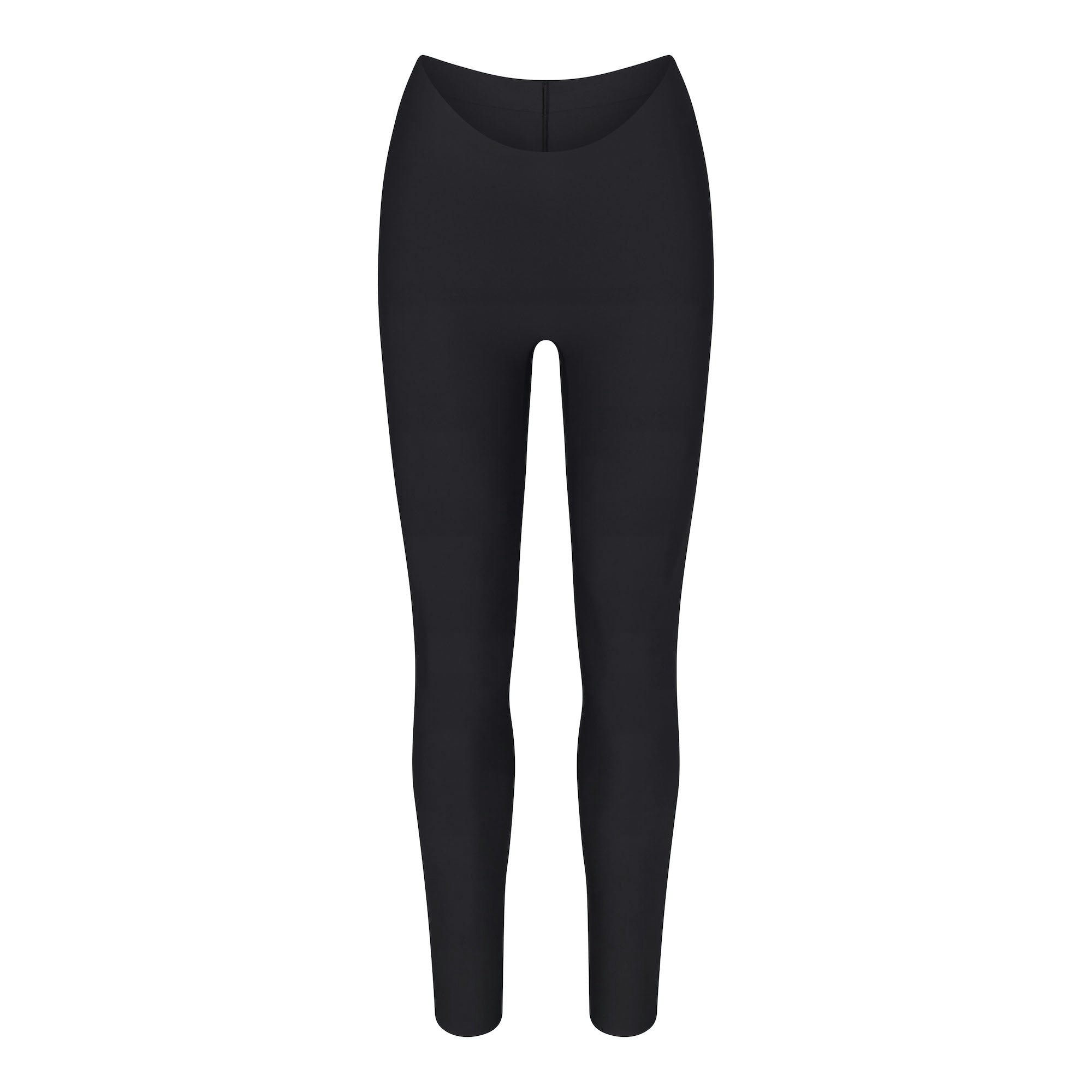 SKIMS BODY DIPPED FRONT LEGGING | ONYX (SHAPEWEAR LEGGINGS, SHAPEWEAR) LAYS FLAT ON A WHITE BACKGROUND