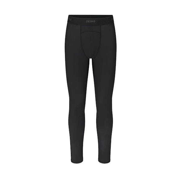 SKIMS SPORT MENS LEGGING | OBSIDIAN (MENS LEGGINGS, MENS BOTTOMS) LAYS FLAT ON A WHITE BACKGROUND | FLT