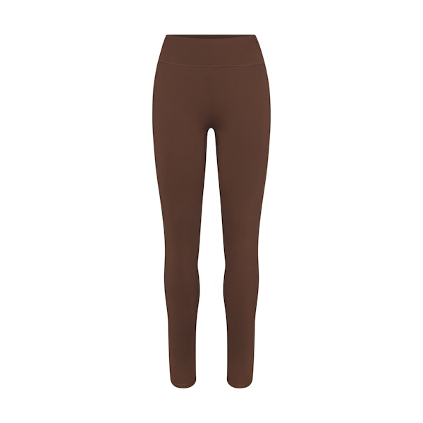 NikeSKIMS MATTE 26" LEGGING | DARK SEPIA FLAT ON A WHITE BACKGROUND | FLT
