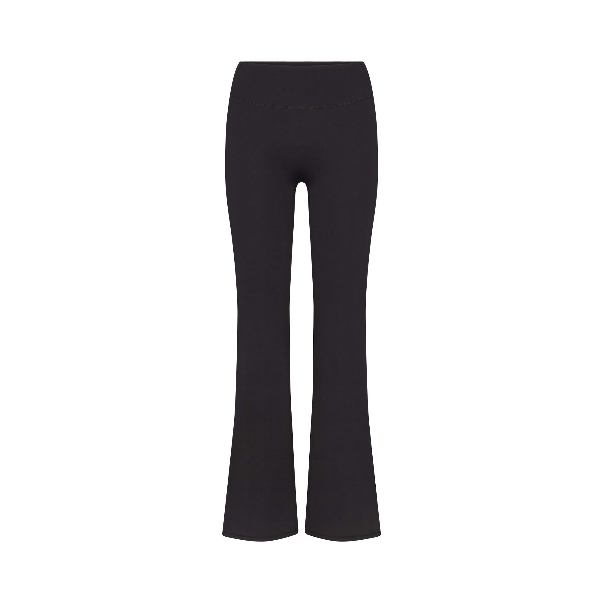 NikeSKIMS MATTE SLIM FLARE LEGGING | OBSIDIAN FLAT ON A WHITE BACKGROUND | FLT