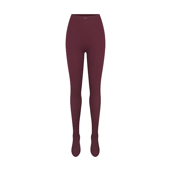 NikeSKIMS MATTE FOOTSIE GRIP LEGGING | CURRANT FLAT ON A WHITE BACKGROUND | FLT