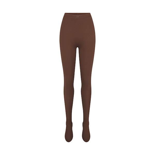 NikeSKIMS MATTE FOOTSIE GRIP LEGGING | DARK SEPIA FLAT ON A WHITE BACKGROUND | FLT