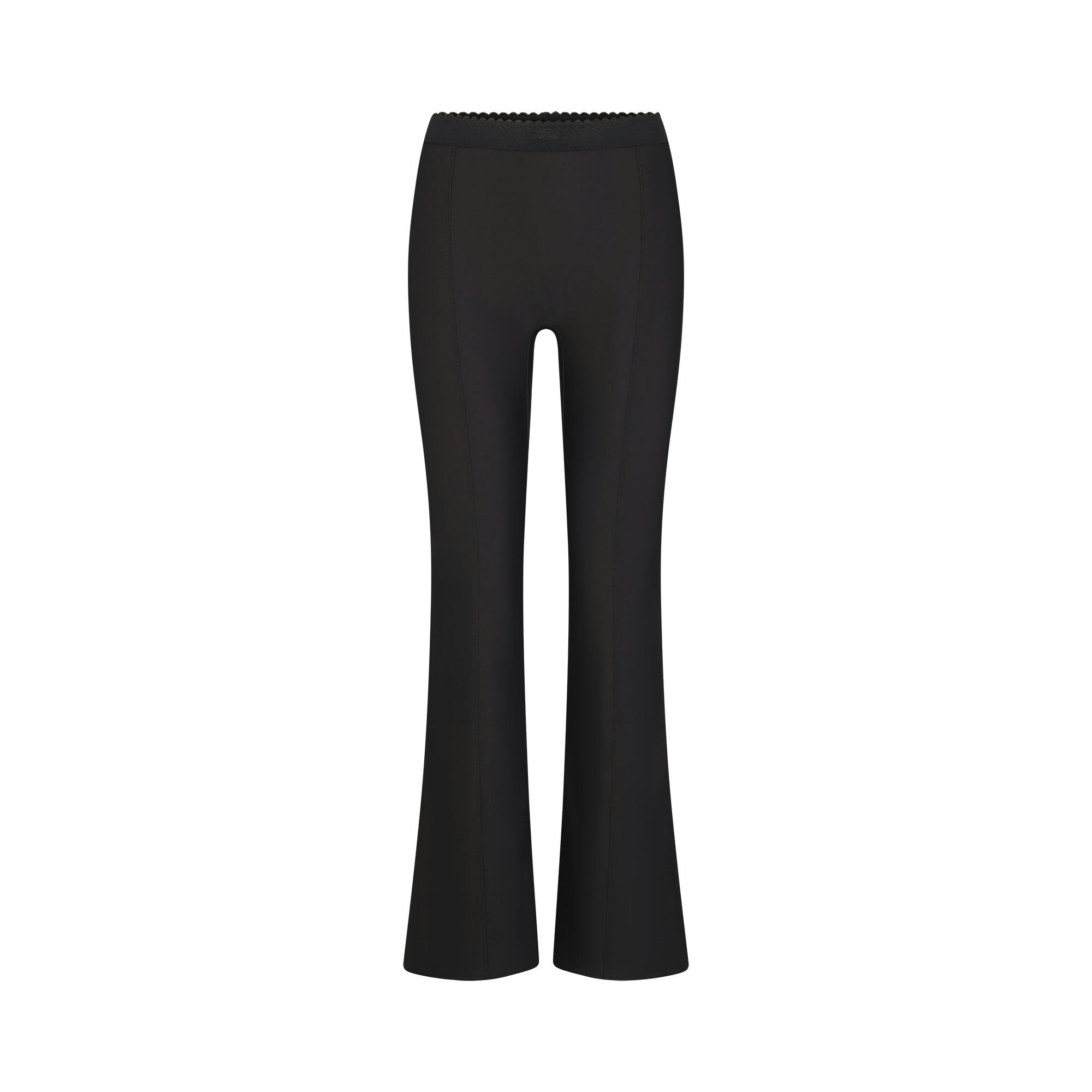 SKIMS BODY HIGH-WAISTED FLARE PANT | ONYX FLAT ON A WHITE BACKGROUND | FLT