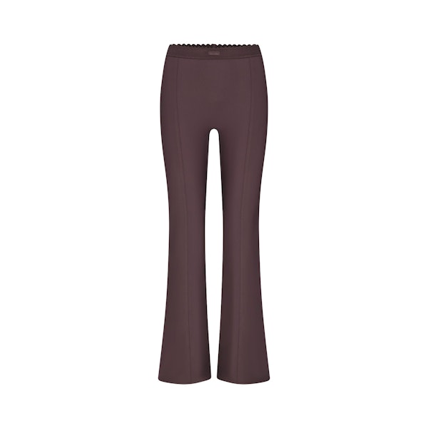 SKIMS BODY HIGH-WAISTED FLARE PANT | RAISIN FLAT ON A WHITE BACKGROUND | FLT