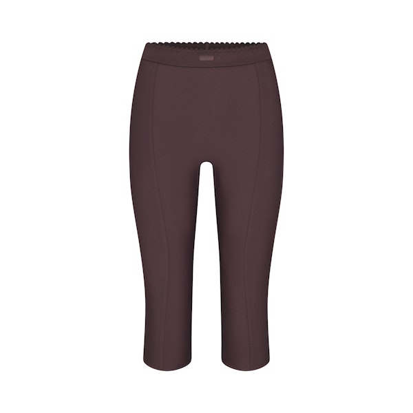 SKIMS BODY HIGH-WAISTED CAPRI | RAISIN FLAT ON A WHITE BACKGROUND | FLT