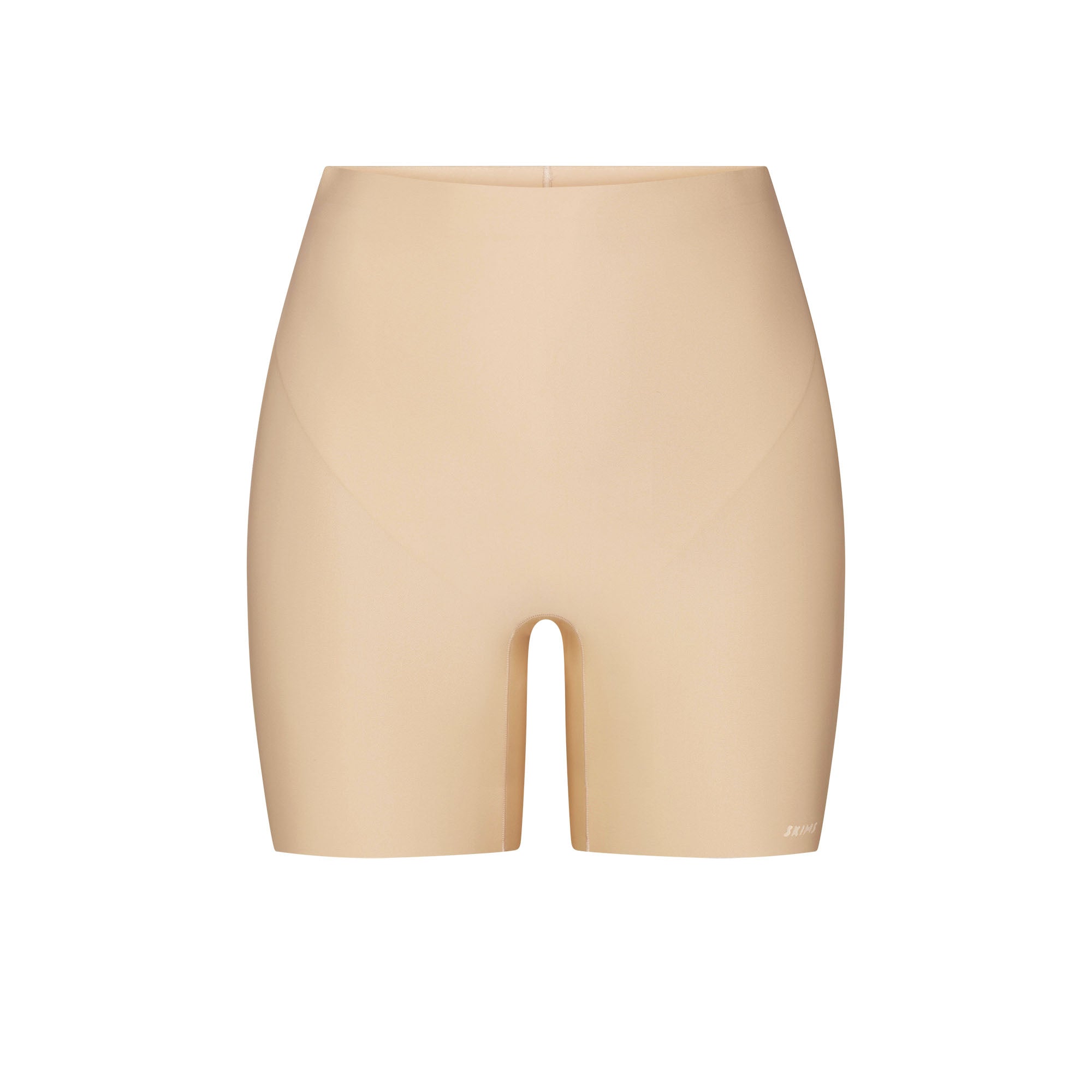SKIMS BODY CORE SCULPT SHORTIE | SAND FLAT ON A WHITE BACKGROUND | FLT
