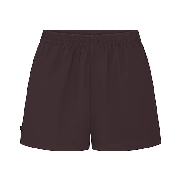 NikeSKIMS WOVEN NYLON 5" TRACK SHORT | PHOENIX FLAT ON A WHITE BACKGROUND | FLT