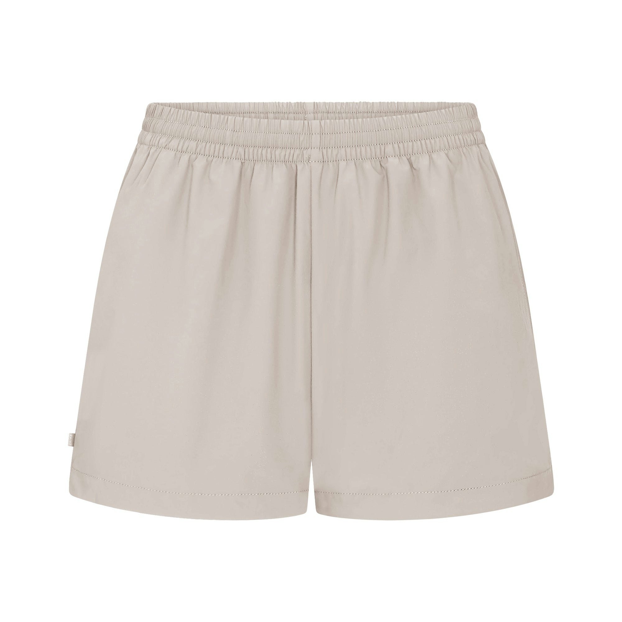 NikeSKIMS WOVEN NYLON 5" TRACK SHORT | STONE FLAT ON A WHITE BACKGROUND | FLT
