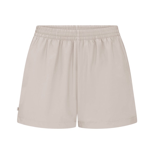 NikeSKIMS WOVEN NYLON 5" TRACK SHORT | STONE FLAT ON A WHITE BACKGROUND | FLT