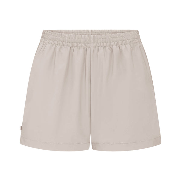 NikeSKIMS STRETCH NYLON RUNNER SHORT | IVORY | SKIMS
