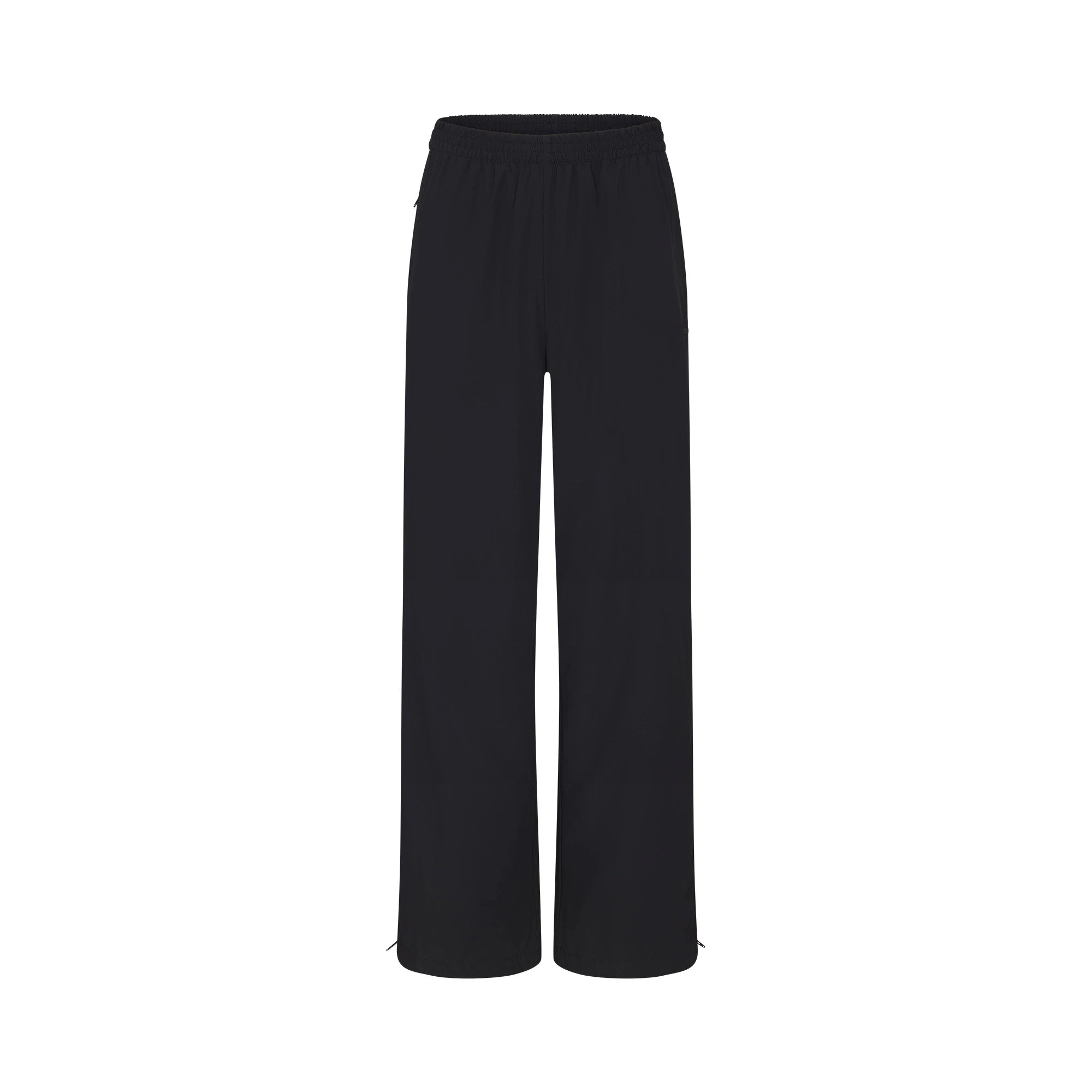 NikeSKIMS WOVEN NYLON OVERSIZED TRACK PANT | OBSIDIAN FLAT ON A WHITE BACKGROUND | FLT