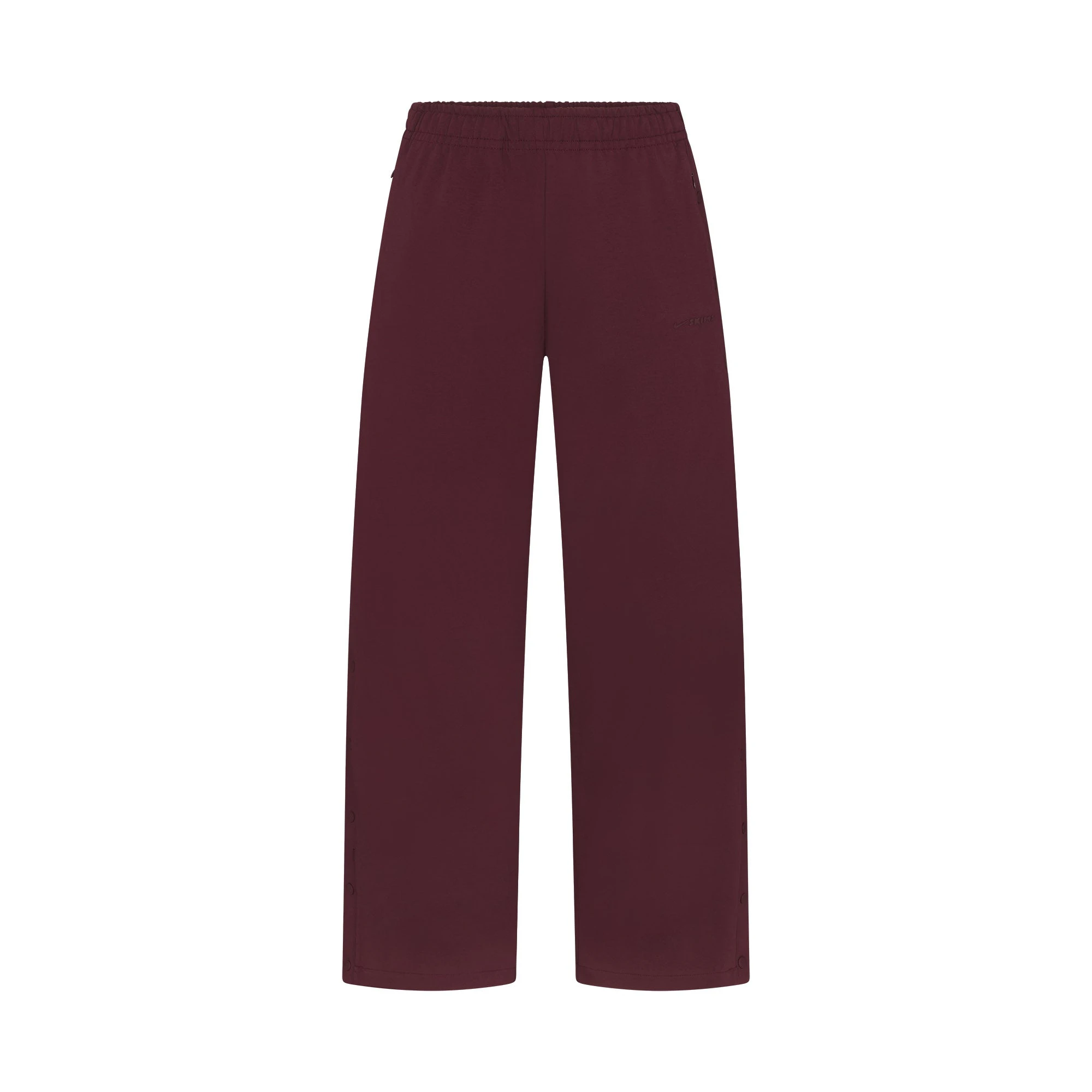 NikeSKIMS MATTE TRICOT SIDE SNAPS PANT | CURRANT FLAT ON A WHITE BACKGROUND | FLT