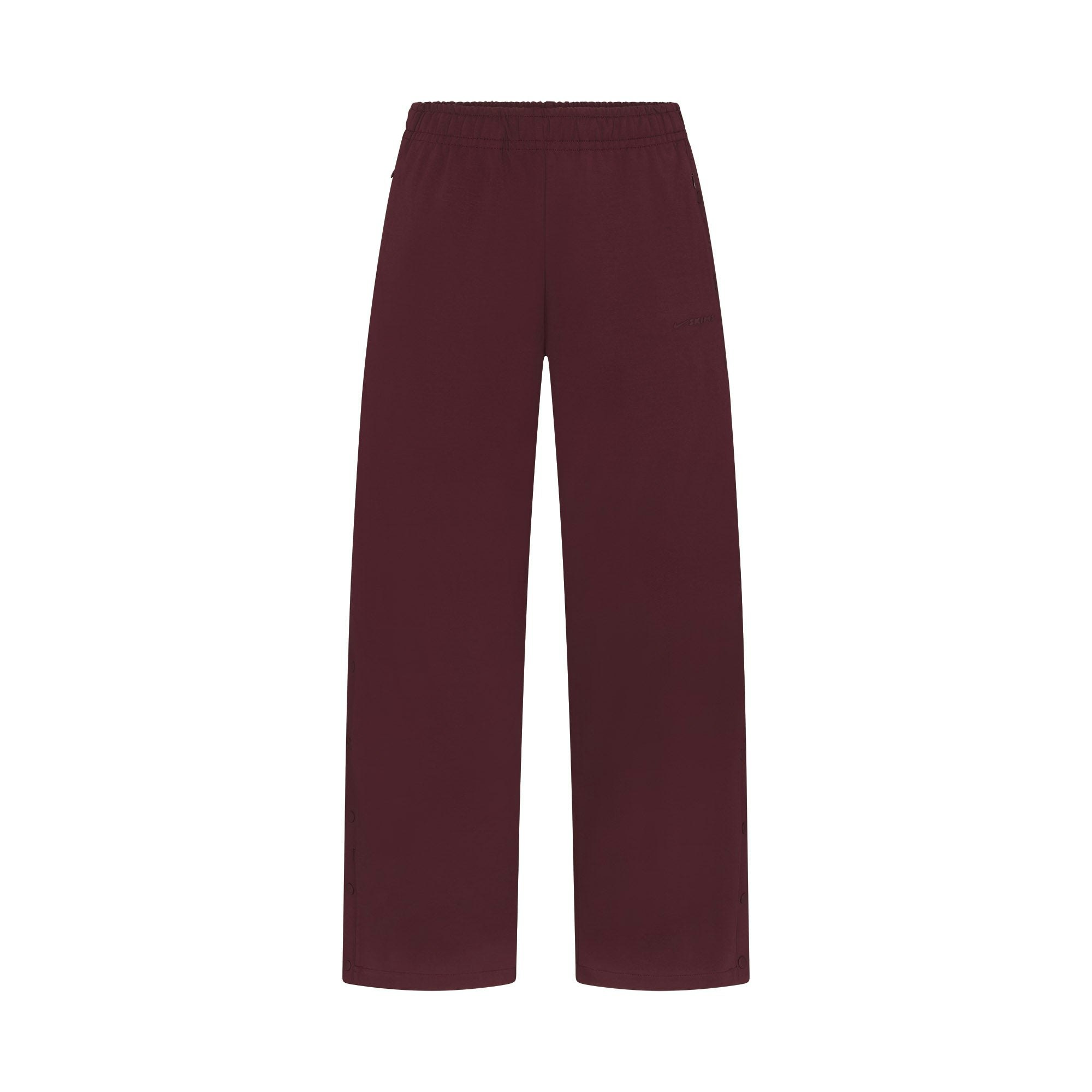 NikeSKIMS MATTE TRICOT SIDE SNAPS PANT | CURRANT FLAT ON A WHITE BACKGROUND | FLT