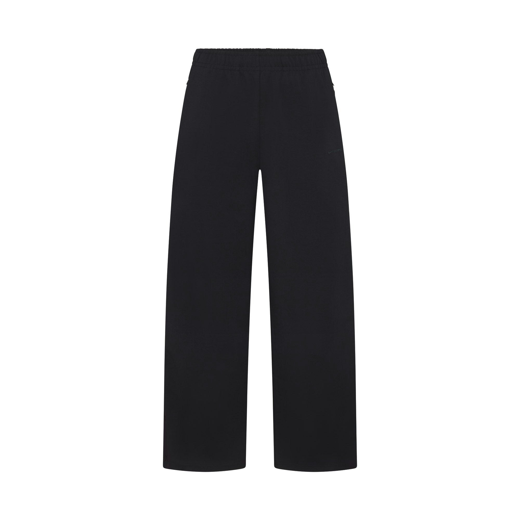 NikeSKIMS MATTE TRICOT SIDE SNAPS PANT | OBSIDIAN FLAT ON A WHITE BACKGROUND | FLT
