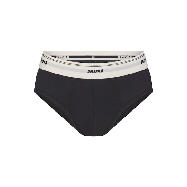 SKIMS COTTON MENS RIB BRIEF | ONYX FLAT ON A WHITE BACKGROUND | FLT