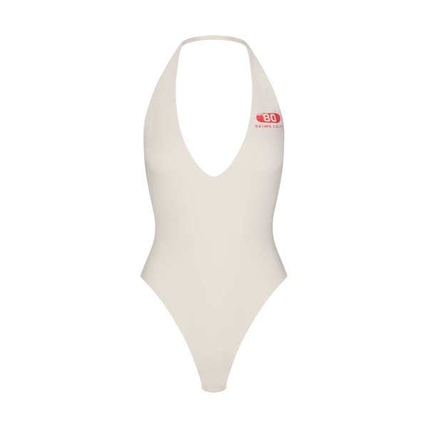 COTTON JERSEY DEEP PLUNGE HALTER BODYSUIT | MARBLE SKIMS EIGHTY FLAT ON A WHITE BACKGROUND | FLT