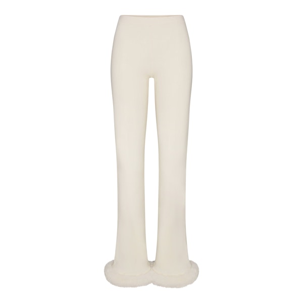 SKIMS CLOUD SLIM FLARE PANT | ECRU FLAT ON A WHITE BACKGROUND | FLT